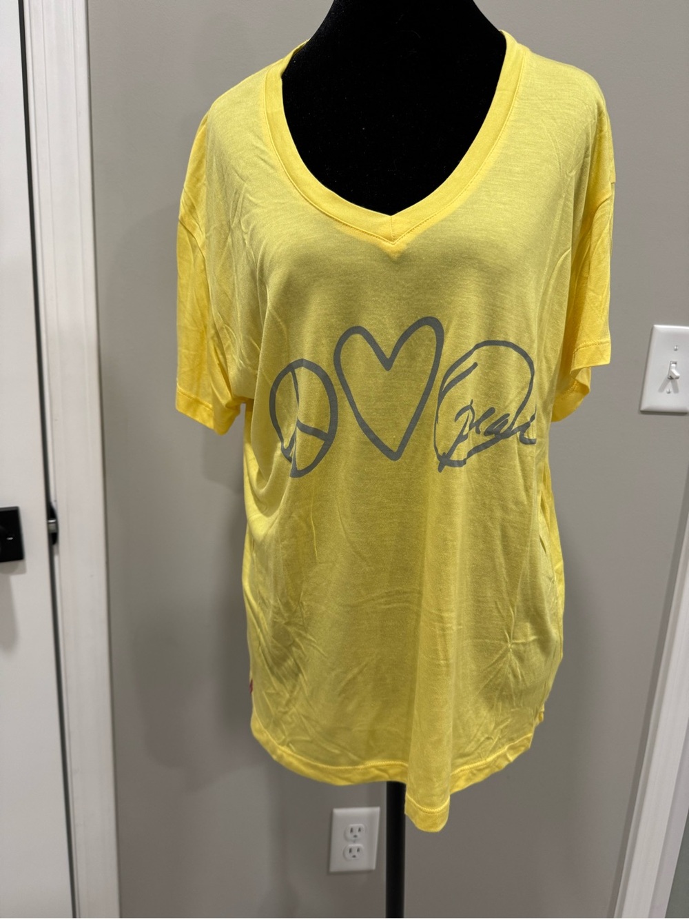 Oprah’s Yellow V-Neck Graphic Tee with Gray Print